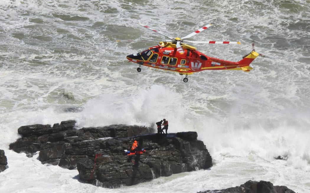 Two fishermen were rescued after facing large swells and becoming trapped on rocks at Sunset Beach on 29 January, 2024.