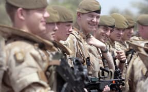 British soldiers pose for a photograph along the parade ground in Baghdad's fortified "Green Zone" on 16 May, 2009.