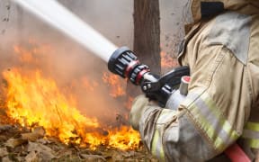 firefighter with hose