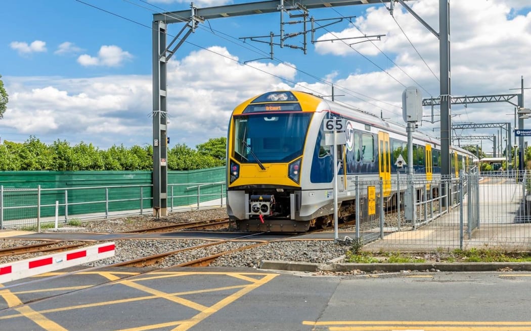 A train approaches a level crossing.