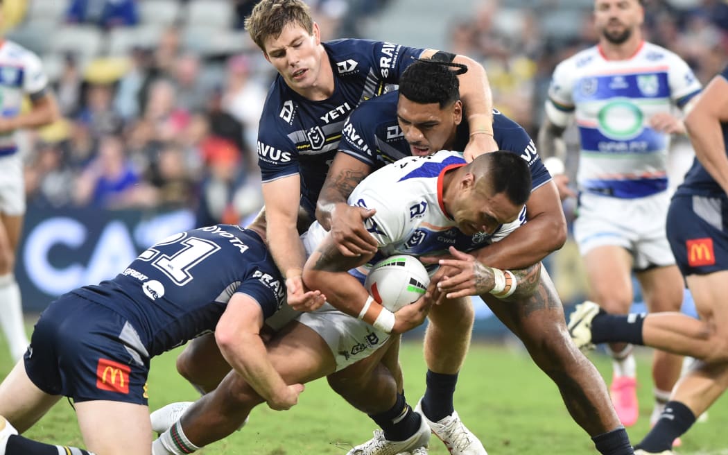Marata Niukore of the Warriors attracts defenders during their NRL match against the North Queensland Cowboys.