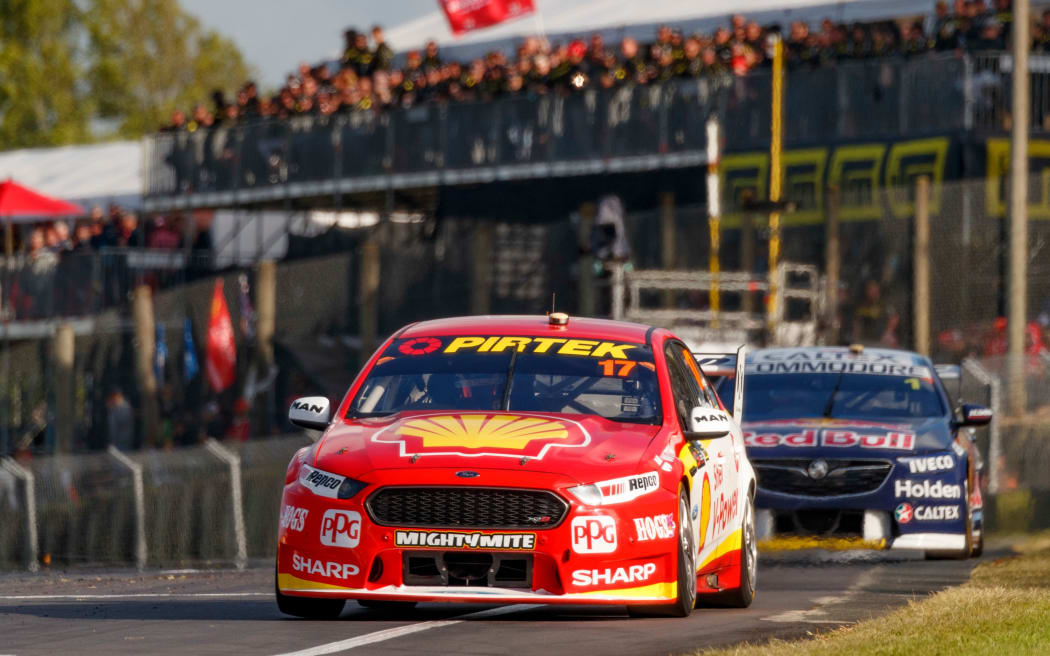 Scott McLaughlin crosses the finish line to win race two of the 2018 Supercars event at Pukekohe ahead of fellow Kiwi driver Shane van Gisbergen.