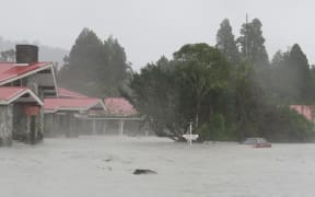The Scenic Hotel Group's Mueller Wing surrounded by floodwaters after the Waiho River broke through a stopbank immediately behind the site in March 2016.