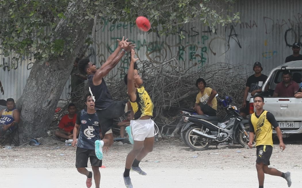 Local AFL games in Nauru - played on the gravel ground.