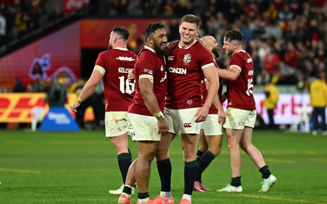Bundee Aki (L) and Owen Farrell celebrate the Lions' win over Australia in the second test in Melbourne.