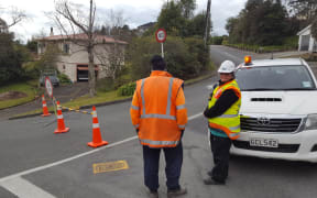 Contractors guard a police cordon in Jenner Rd, Nelson.