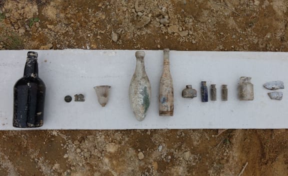 Artefacts found include ink wells and beer bottles.