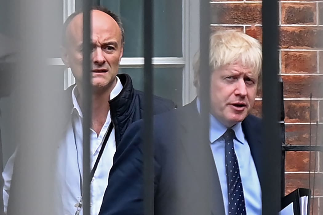 Britain's Prime Minister Boris Johnson (right) and his special advisor Dominic Cummings leave Downing Street in central London.