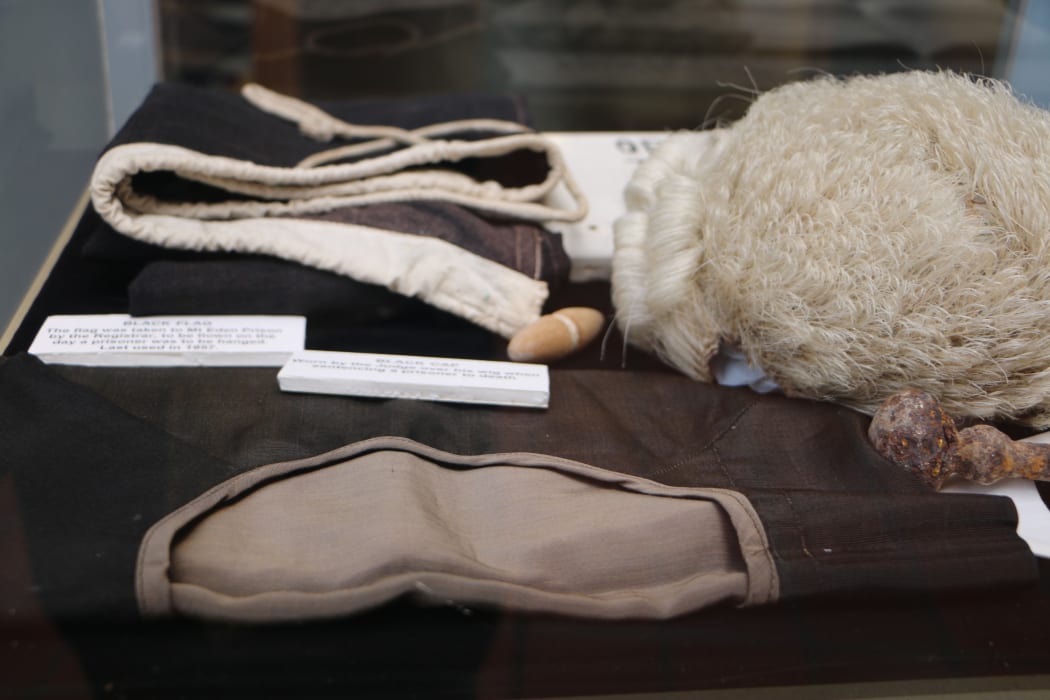 Foreground- The black cap worn by the judge over their wig when sentencing someone to death.

Back- the black flag flown at Mt Eden Prison on the day a prisoner was to be hanged. Last used in 1957.
