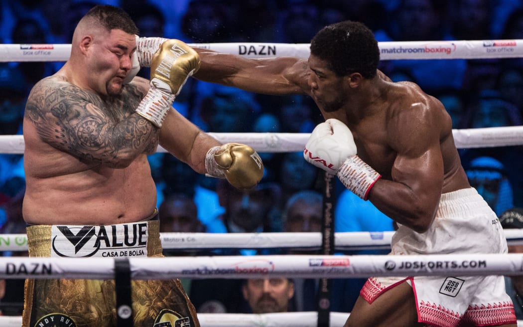 US-Mexican professional boxer Andy Ruiz Jr (L) in action against Britain's Anthony Joshua during their World Heavyweight Championship contest at the Diriyah Arena.
