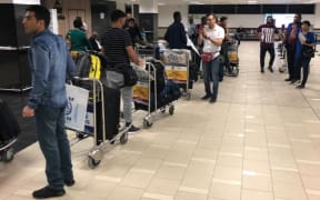 Refugees at Port Moresby airport 26 June, 2019.