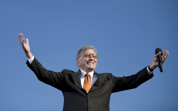 (FILES) Singer Tony Bennett performs during the "Rally To Restore Sanity and/or Fear" on the National Mall on October 30, 2010 in Washington, DC. Bennett, the last in a generation of classic American crooners whose ceaselessly cheery spirit bridged generations to make him a hitmaker across seven decades died on July 21, 2023, in New York, US media reported. He was 96. (Photo by Brendan SMIALOWSKI / AFP)
