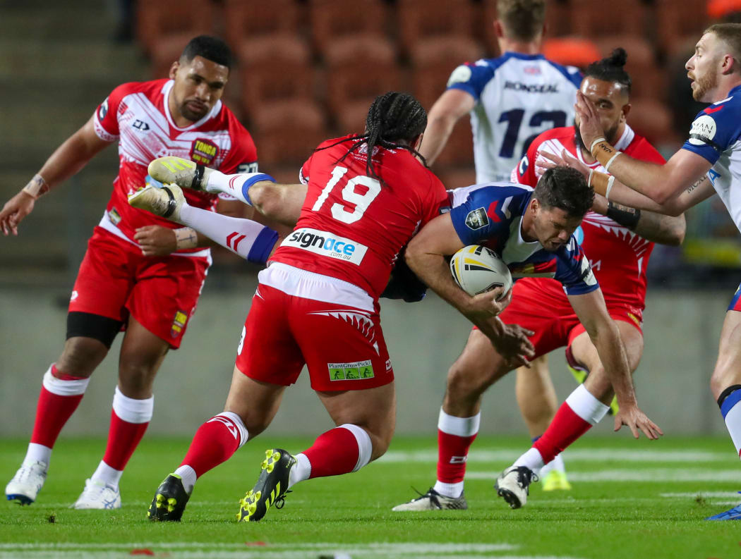 Konrad Hurrell tackles Lachlan Coote.
