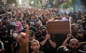 Palestinians carry the coffin of Palestinian Musa Hassune who was killed by an Israeli gunman's fire.