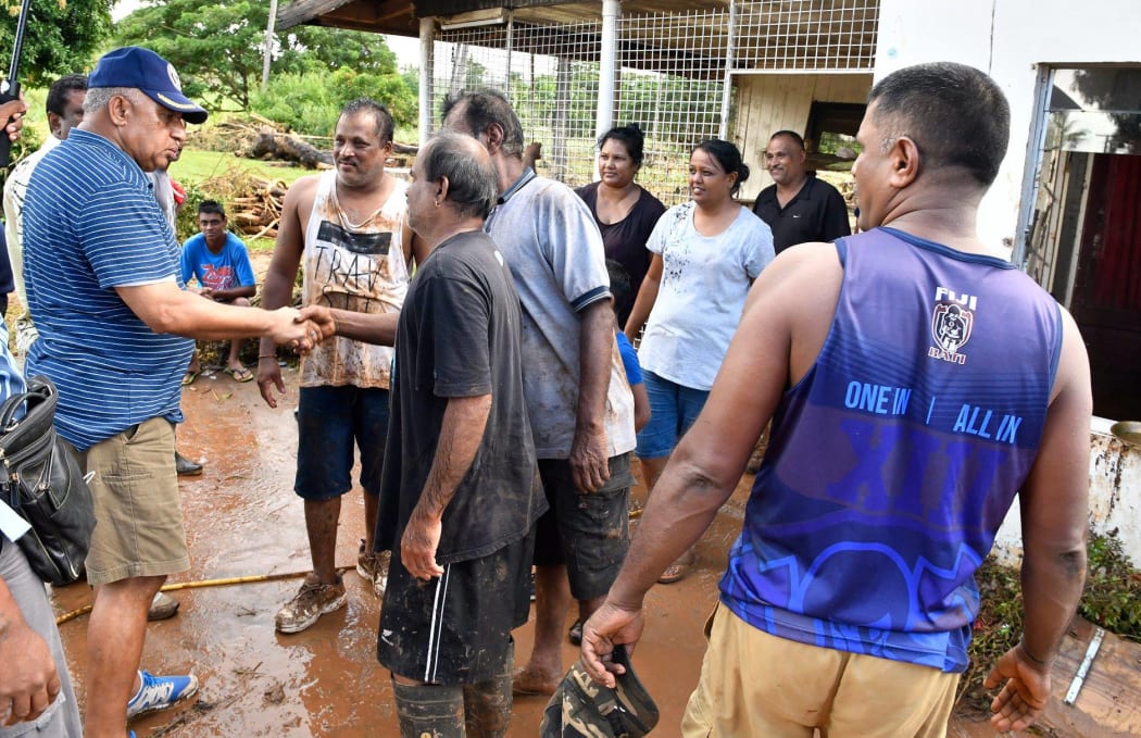 Fiji Prime Minister Frank Bainimarama visits a community in Ba which was hit by floods caused by Cyclone Josie.