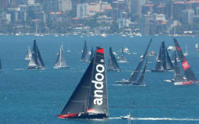 Andoo Comanche prepares for the start of the Sydney to Hobart Yacht race seen from North Head in Sydney.