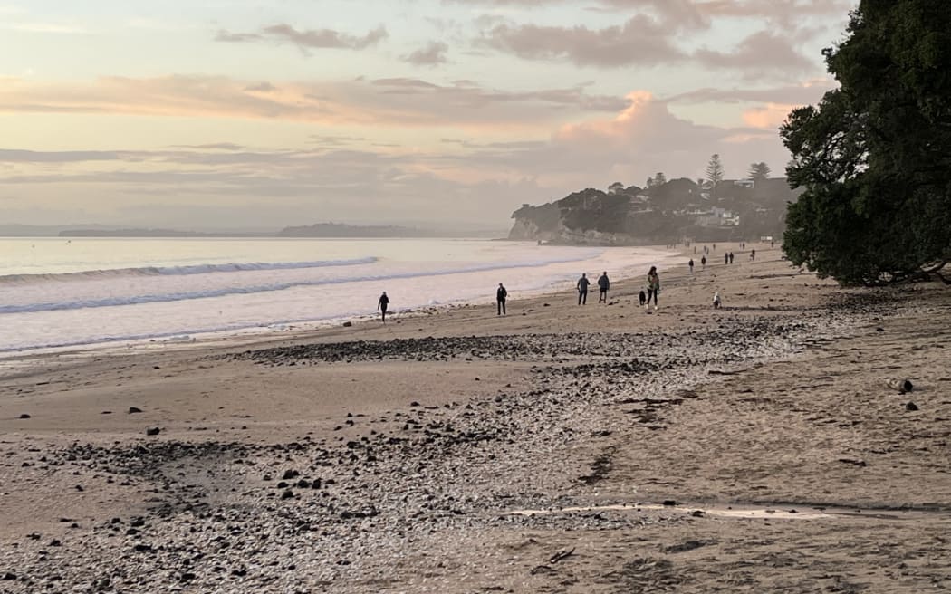 Despite warnings, people were out on Takapuna Beach on Thursday morning.