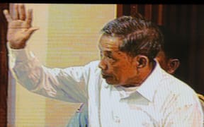 A livefeed video grab taken on July 13, 2009, shows Kaing Guek Eav better known as Comrade Duch, the former Khmer Rouge prison chief of S-21 or Tuol Sleng prison, in the courtroom during his trial at the Extraodinary Chambers in the Courts of Cambodia (ECCC) in Phnom Penh.