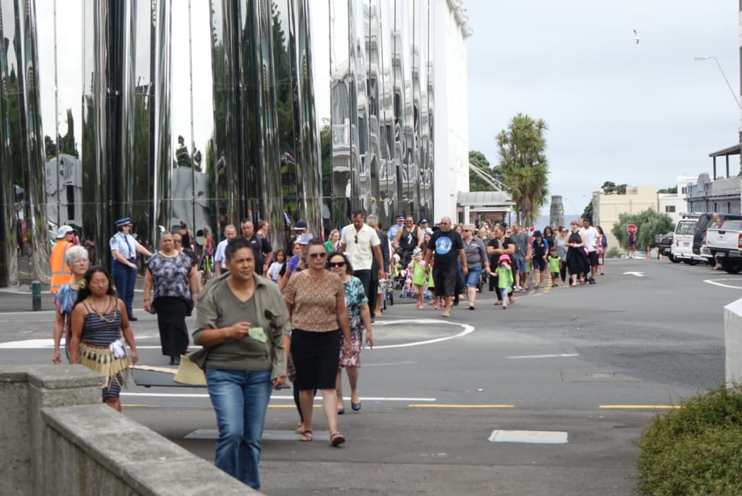 The Walk For Peace passes in front of the Len Lye Centre on its way to the courthouse in New Plymouth.