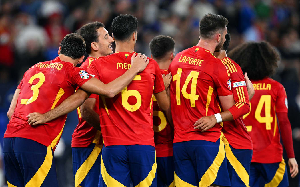 Spain's players celebrate after the win over Italy at Euro 2024.