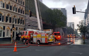 A crane working at the side of the convention centre building