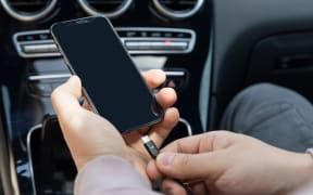Charging smartphone inside the car/vehicle using a USB cable.