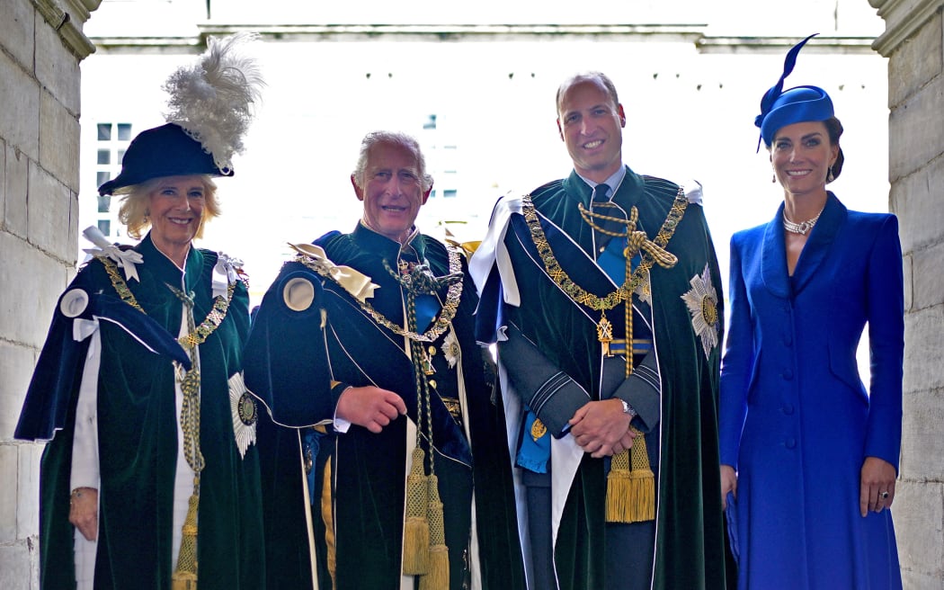 (L-R) Britain's Queen Camilla, Britain's King Charles III, Britain's Prince William, Prince of Wales and Britain's Catherine, Princess of Wales pose for a photograph after watching a fly-past by the British Royal Air Force's (RAF) aerobatic team, the "Red Arrows", from the Palace of Holyroodhouse, in Edinburgh on July 5, 2023, following a National Service of Thanksgiving and Dedication. Scotland on Wednesday marked the Coronation of King Charles III and Queen Camilla during a National Service of Thanksgiving and Dedication where the The King was presented with the Honours of Scotland. (Photo by Yui Mok / POOL / AFP)