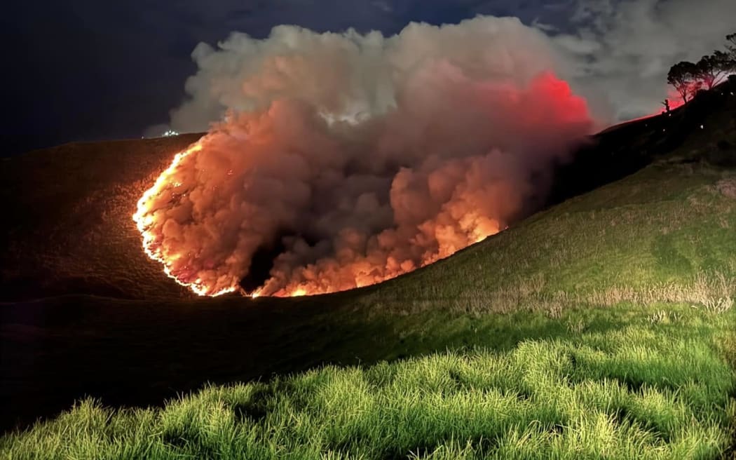 A blaze spreads on Auckland's Māngere Mountain on Saturday.