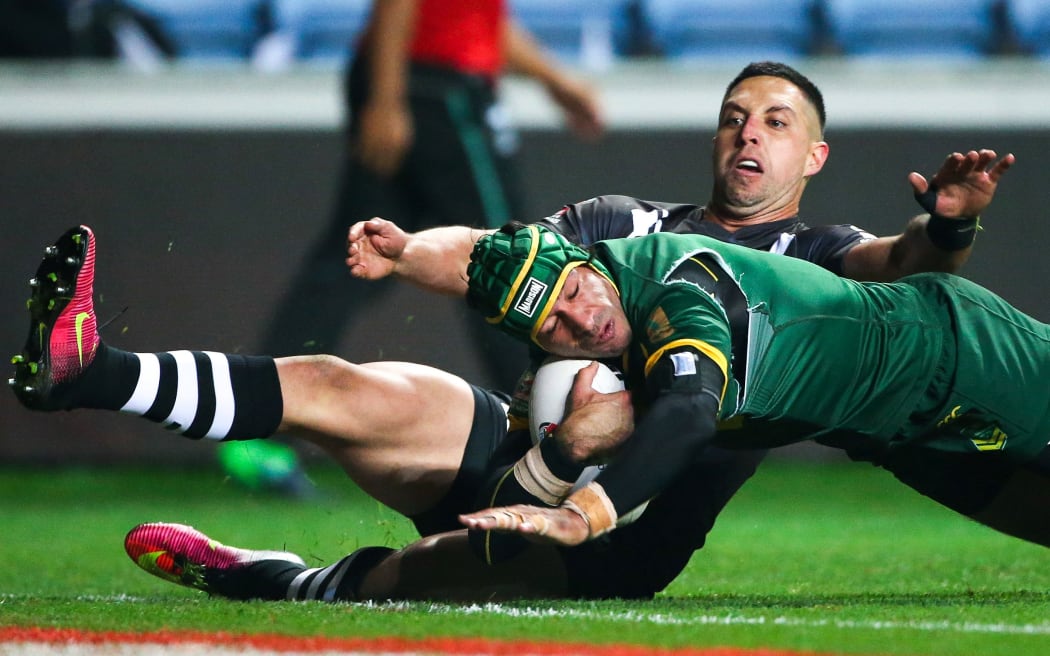 Johnathan Thurston scores against the Kiwis.