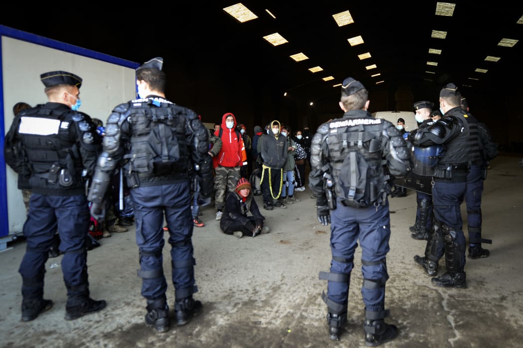 French gendarmes break up an illegal rave that around 2,500 took part in near a disused hangar in Lieuron, France..