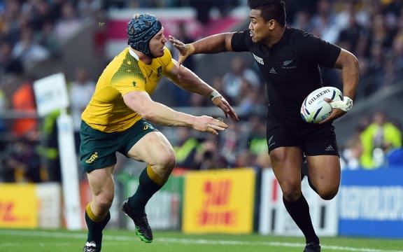 All Black Julian Savea fends off David Pocock during the RWC 2015 final.