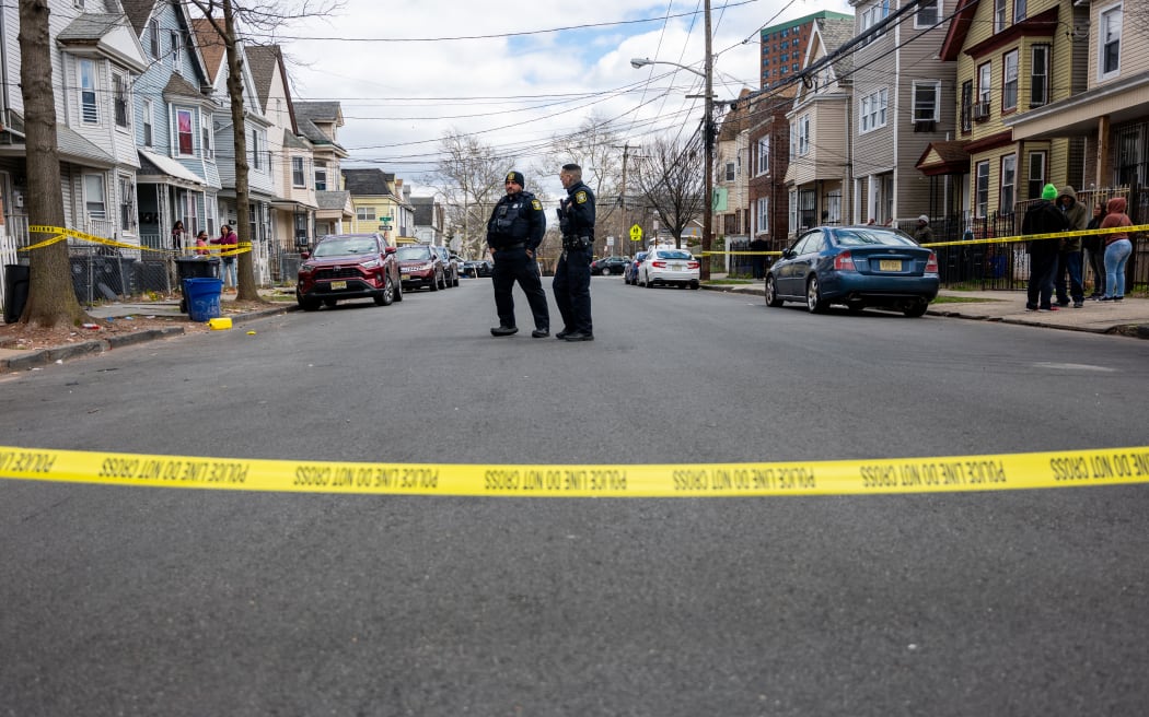 NEWARK, NEW JERSEY - APRIL 05: Residents and police gather outside of homes that were structurally damaged and had to be evacuated after New York City and parts of New Jersey experienced a 4.8 magnitude earthquake on April 05, 2024 in Newark, New Jersey. There were no reported injuries in the late morning earthquake, but many people reported visible shaking in buildings and homes. Tremors were felt from Philadelphia to Boston.   Spencer Platt/Getty Images/AFP (Photo by SPENCER PLATT / GETTY IMAGES NORTH AMERICA / Getty Images via AFP)