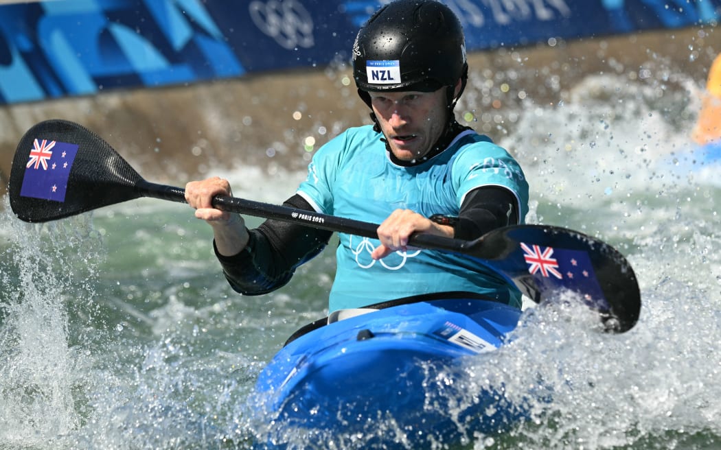 New Zealand's Finn Butcher competes in the men's kayak cross quarterfinal of the canoe slalom competition at Vaires-sur-Marne Nautical Stadium in Vaires-sur-Marne during the Paris 2024 Olympic Games on August 5, 2024. (Photo by Bertrand GUAY / AFP)