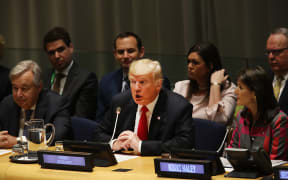 US President Donald Trump attends a meeting on the global drug problem at the United Nations (UN) with UN Ambassador Nikki Haley.