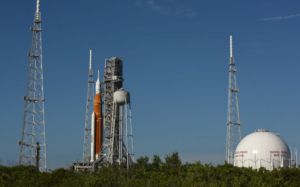 NASA's Artemis 1 rocket stands ready for launch on pad 39-B at the Kennedy Space Center on 27 August, 2022, in Cape Canaveral, Florida. The rocket is being prepared for an unmanned flight around the moon on 29 August.