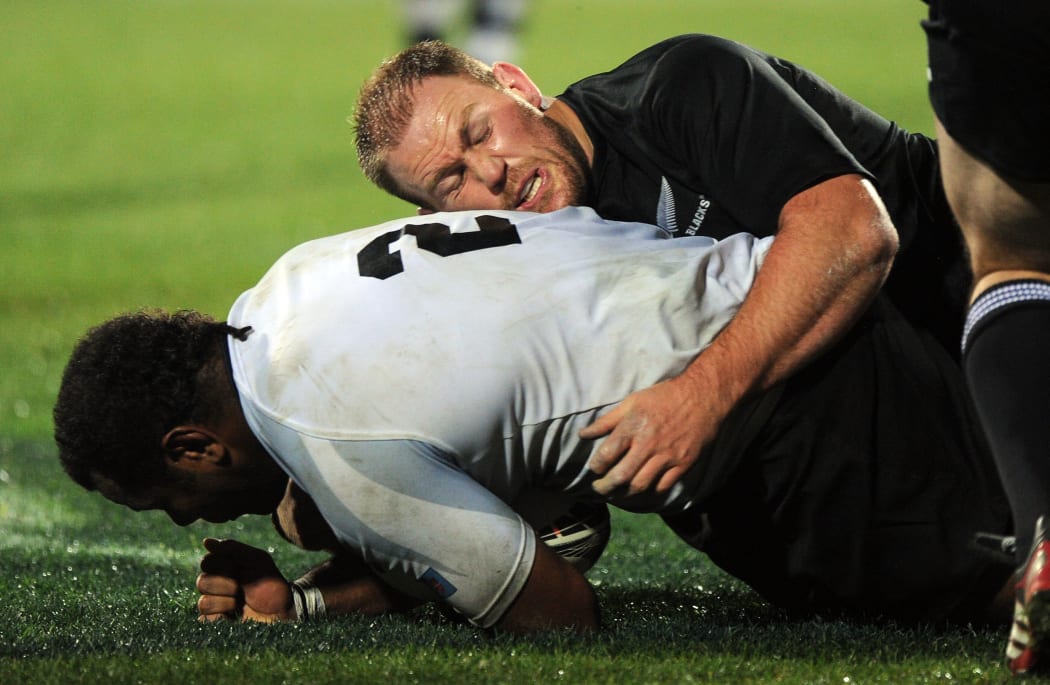 Ben Franks tackles Sunia Koto during the All Blacks vs Flying Fijians test in Dunedin in 2011.