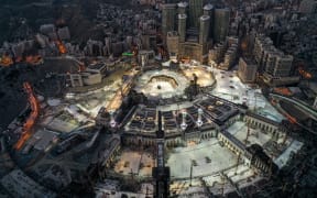 This picture taken during of Eid al-Fitr, which starts at the conclusion of Ramadan, shows the Grand Mosque and Kaaba in Mecca. Saudi Arabia began a five-day, round-the-clock curfew from May 23 after COVID-19 infections soared since the start of Ramadan to around 68,000.