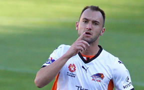 A Brisbane Roar player celebrates a goal.