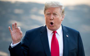 US President Donald Trump speaks to the media as he walks to Marine One prior to departure from the South Lawn of the White House in Washington, DC, July 10, 2018, as they travel on a week-long trip to Europe, with stops in Brussels, London, Scotland and Helsinki.