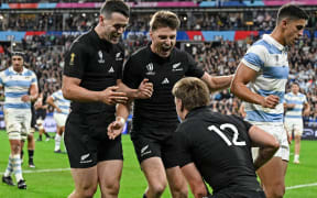 Will Jordan  and Beauden Barrett  celebrate a try by Jordie Barrett.
