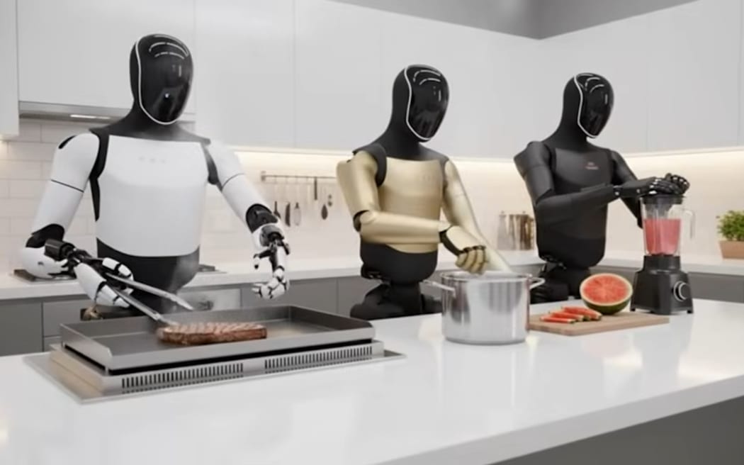 Three Tesla bots in the kitchen.