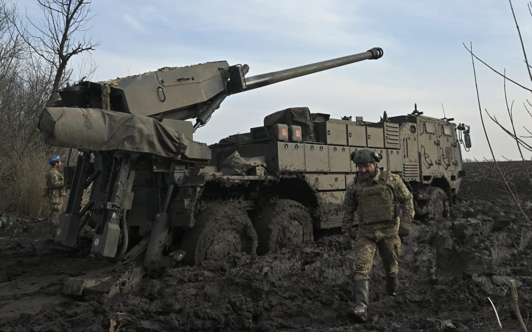 Ukrainian servicemen of the Air Assault Forces prepare to fire a 155mm Caesar 8x8 wheeled self-propelled howitzer on a frontline in an undisclosed location, Southern Ukraine on February 14, 2024, amid the Russian invasion of Ukraine. (Photo by Genya SAVILOV / AFP)