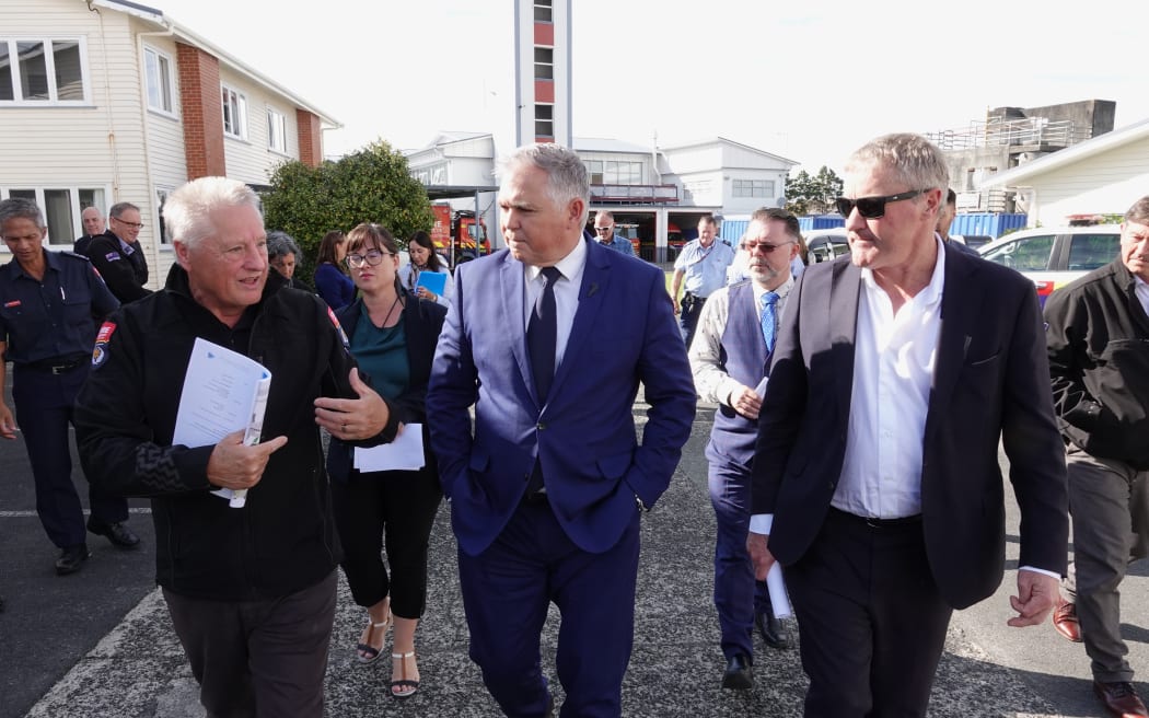 Fire and Emergency property manager Mal Tipton, left, gives Emergency Management Minister Mark Mitchell a tour of the emergency coordination centre site, with Northland MP Grant McCallum, right.