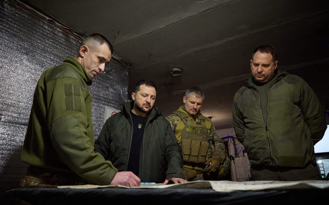 This handout photograph taken and released by Ukrainian Presidential Press Service on December 29, 2023, shows Ukrainian President Volodymyr Zelensky (2nd L) visiting the advanced checkpoint of the 110th Separate Mechanized Brigade named after late Ukrainian General-Corporal Marko Bezruchko in the town of Avdiivka, Donetsk region, amid the Russian invasion of Ukraine. (Photo by Handout / UKRAINIAN PRESIDENTIAL PRESS SERVICE / AFP) / RESTRICTED TO EDITORIAL USE - MANDATORY CREDIT "AFP PHOTO / UKRAINIAN PRESIDENTIAL PRESS SERVICE " - NO MARKETING NO ADVERTISING CAMPAIGNS - DISTRIBUTED AS A SERVICE TO CLIENTS