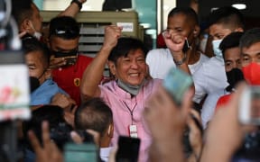 Ferdinand Marcos Jr celebrates with supporters.