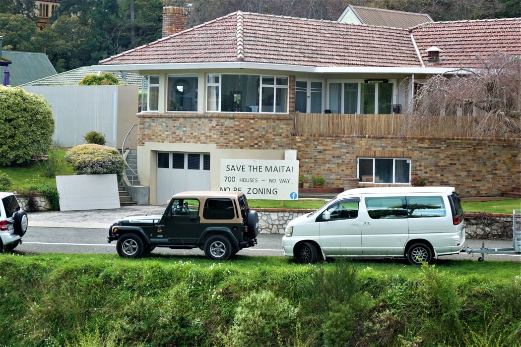 Save The Maitai sign on riverside home.