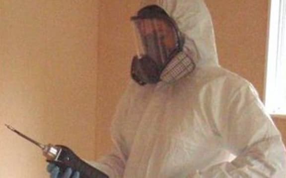 Testing air quality in a clan lab.