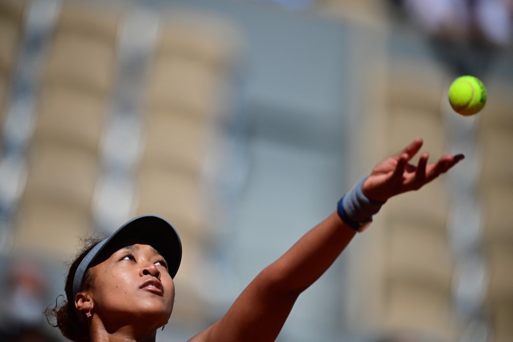 File photo: Japan's Naomi Osaka eyes the ball as she serves to Romania's Patricia Maria Tig during their women's singles first round tennis match on Day 1 of the French Open tennis tournament