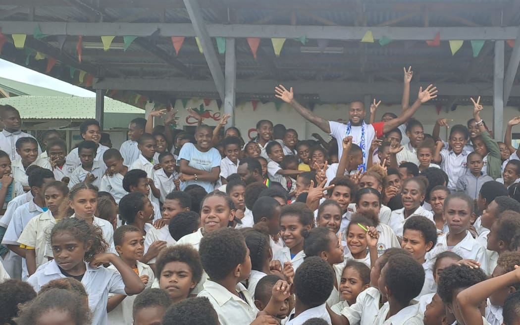 Brian Kaltak on a visit to his old school, Vila North School