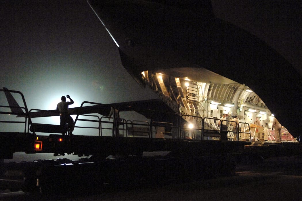 Cargo is unloaded from a C-17 Globemaster III aircraft at Balad air base in 2008.